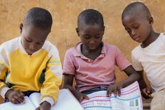 close-up-african-kids-reading-together-scaled